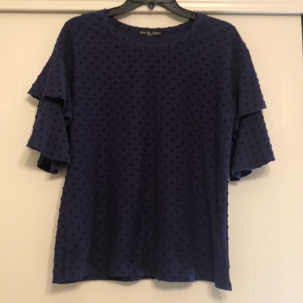 Navy blue Swiss dot blouse with ruffle sleeves